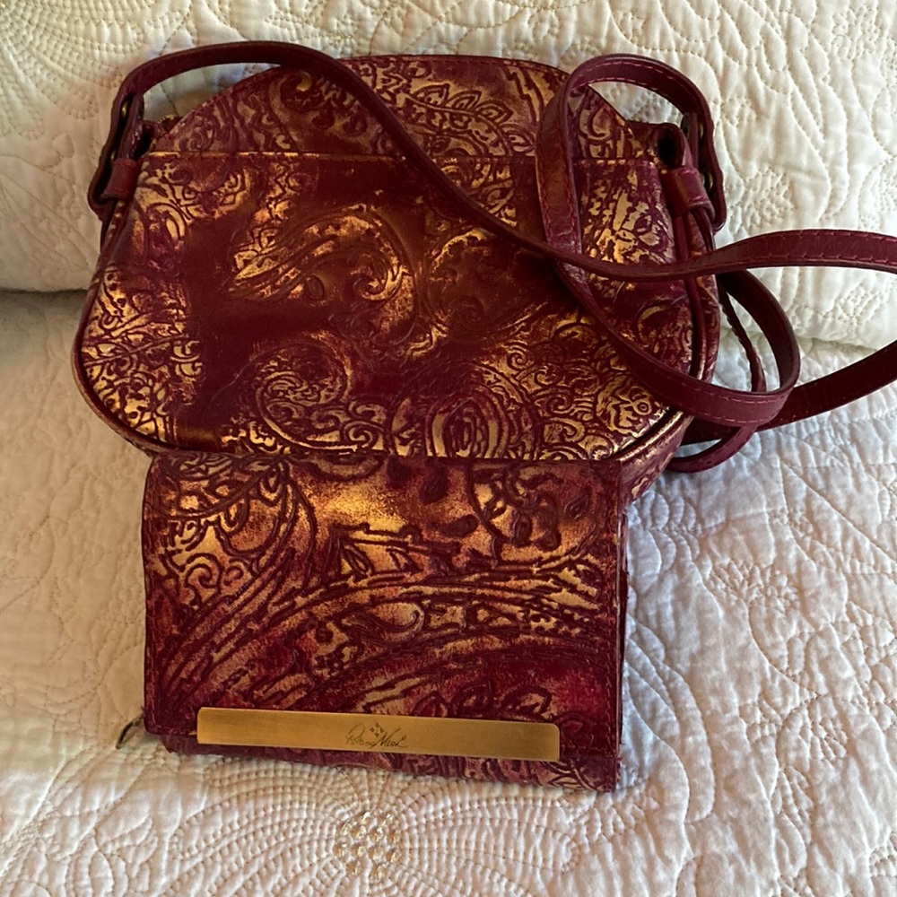 Ladies Patricia Nash Italian leather crossbody and matching wallet.